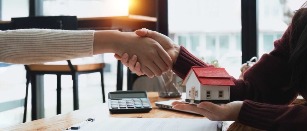 real-estate-agents-and-customers-shake-hands-to-co-2025-01-10-05-56-28-utc-scaled.jpg